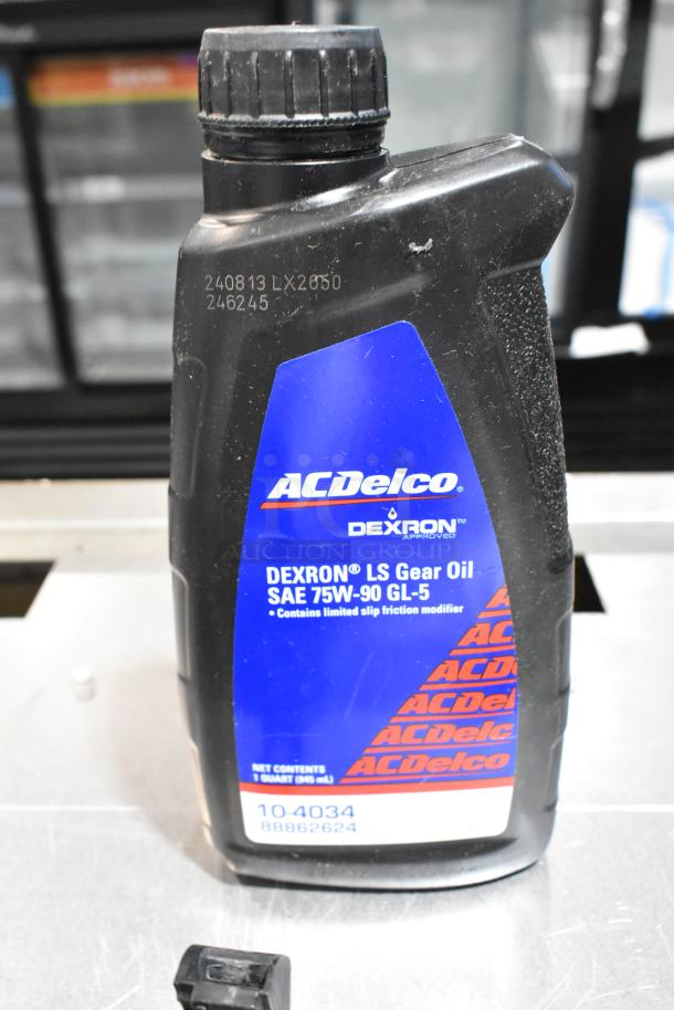 ALL ONE MONEY! Lot includes ACDelco Dexron LS Gear Oil, SAE 75W-90 GL-5, 1 quart. Black poly bin and Brother label printer.
