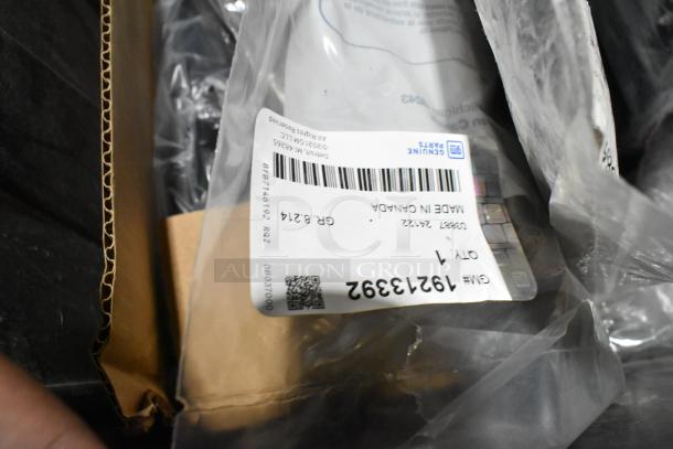 Lot of various items in black poly bin, including ACDelco Dexron LS gear oil and Brother label printer, with visible label.