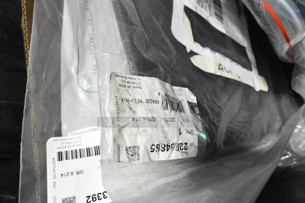 Lot of various items including ACDelco Dexron LS gear oil and Brother label printer in black poly bin, tags shown.