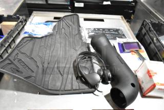 Lot of various items including black floor mats, headphones, and a black poly bin. Mixed condition, assorted uses.