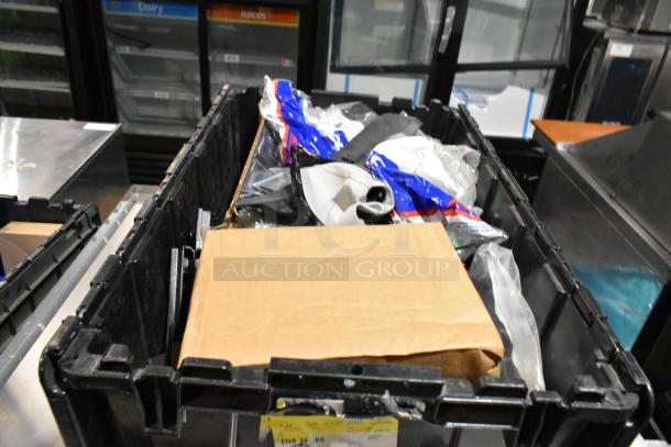 Black poly bin with various items, including GM 84713664 door handles. Items appear new in packaging.