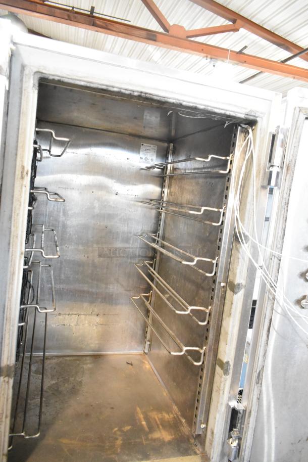 Randell BC-18 stainless steel blast chiller, interior view, with shelves and visible wiring. Model and voltage information tag present.