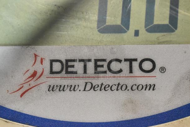 Detecto SCS30 scale label showcasing brand logo and website.
