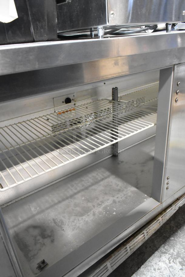 Beverage Air WTR60A stainless steel 2-door undercounter cooler with commercial casters; 115 volts, 1 phase.