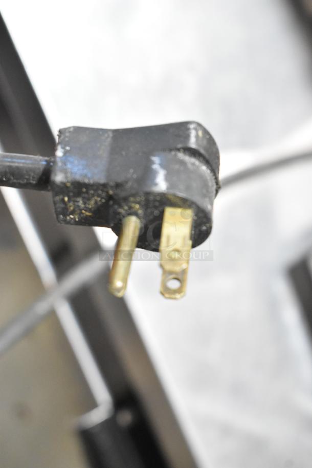 Black power plug for Beverage Air WTR60A cooler, 115 volts, 1 phase. Close-up view showing prongs and condition.