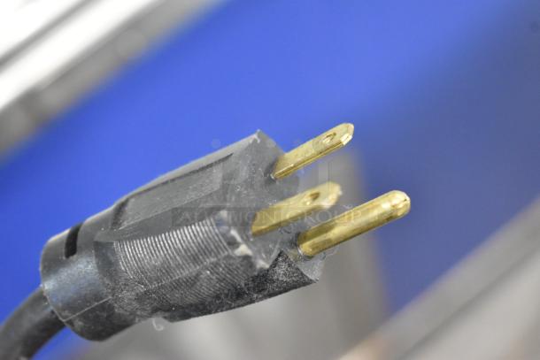 Close-up of a plug for the 2019 Piper Products 4-OTR-2 Stainless Steel Elite Omnitop Cold Food Display Case. 208V, 1 Phase.