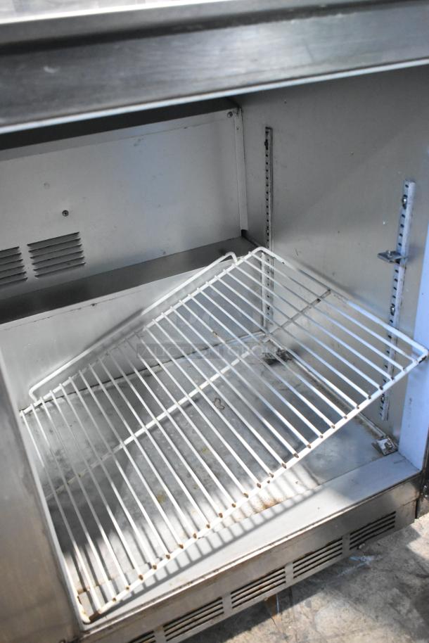 Beverage Air UCR48A stainless steel 2 door undercounter cooler, 115 volts, 1 phase, interior shown with shelving.