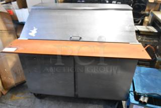 Beverage Air SPE48-18M stainless steel prep table, commercial casters, 115V, lightly worn, suitable for sandwich and salad prep.