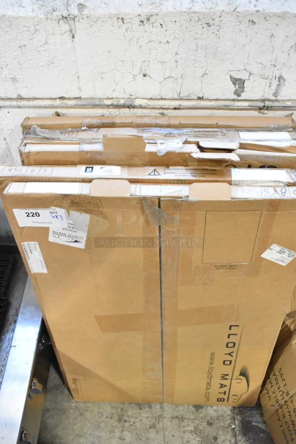7 brand new scratch and dent items in boxes, including GM and Corvette floor mats, Lloyd Mats labeled.