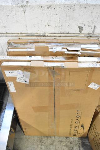 7 brand new scratch and dent items in boxes, including GM and Corvette floor mats, Lloyd Mats labeled.