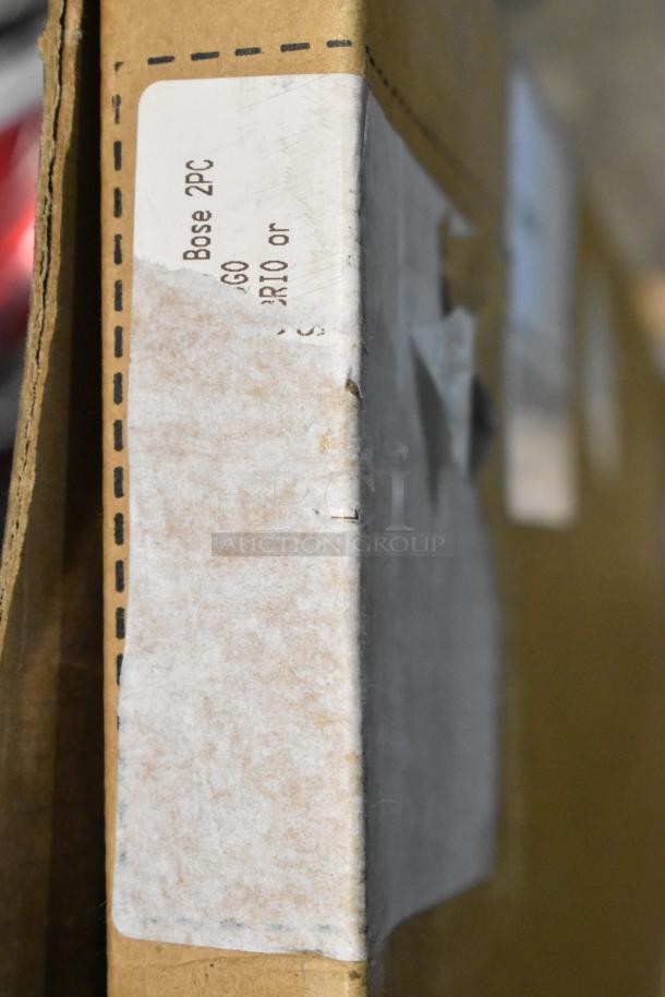 Cardboard box with corner label marked "Bose 2PC 60", indicating contents related to a GM or Corvette floor mat.