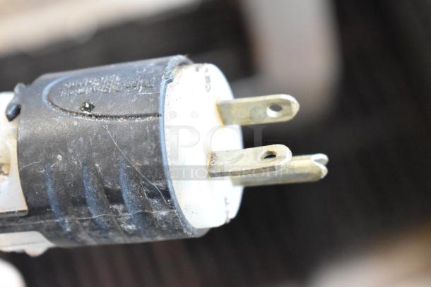 Close-up of a power plug for Hatco TQ-800HBA toaster oven, showing a three-prong configuration.