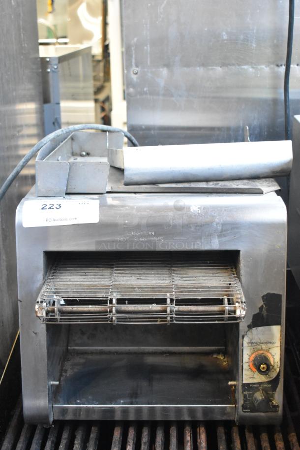 Holman stainless steel commercial countertop conveyor toaster oven, 208V, 1 phase, used condition, visible controls and caution label.
