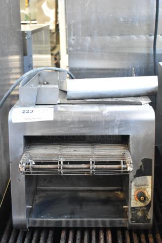 Holman stainless steel commercial countertop conveyor toaster oven, 208V, 1 phase, used condition, visible controls and caution label.