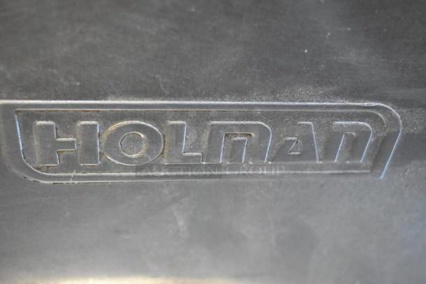 Holman stainless steel commercial countertop conveyor toaster oven logo, showing brand name. 208 Volts, 1 Phase.