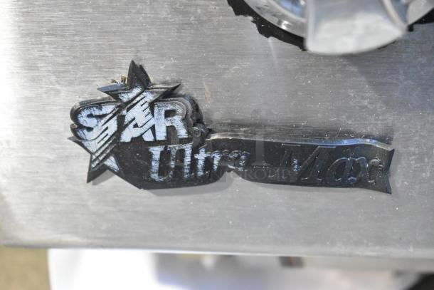 Star Ultra-Max stainless steel charbroiler grill logo, showing brand marking on the metal surface.