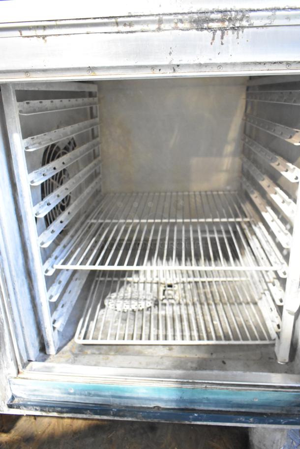 Alto Shaam CTP7-20E stainless steel commercial combi convection oven interior, visible racks, used condition.