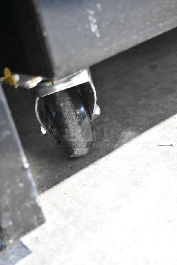 Mainstreet 829GMC49B metal cooler caster. Commercial grade, durable design, part of 2 door merchandiser setup.
