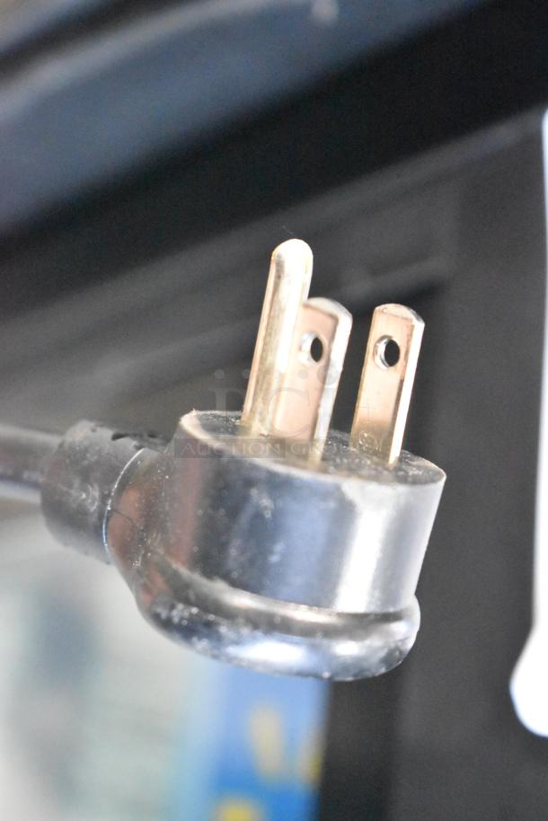 A close-up of the electrical plug for a True Metal Commercial 2 Door Reach In Cooler, 115 Volts, 1 Phase.