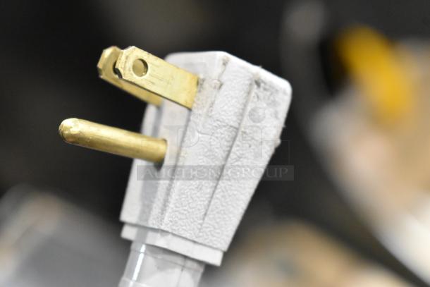 Close-up of a power plug. The True GDM-41SL-60-LD cooler is not visible in this image.