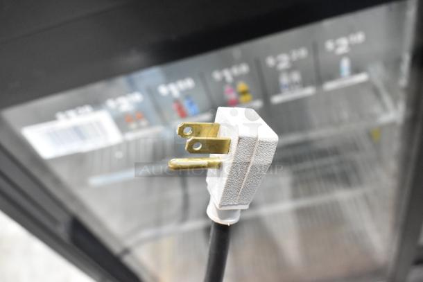 2019 True GDM-41SL-48-HC-LD 2-door reach-in cooler with poly coated racks, showing 115V plug detail.