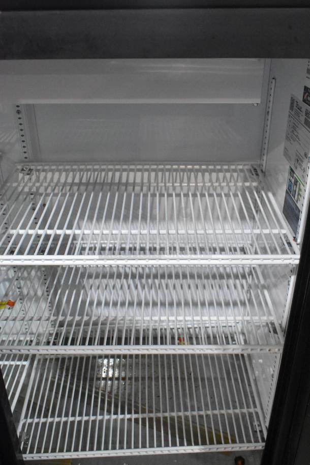 2019 True GDM-41SL-48-HC-LD 2-door cooler, poly coated racks, interior view, clean, 115V, 1 phase, label visible.