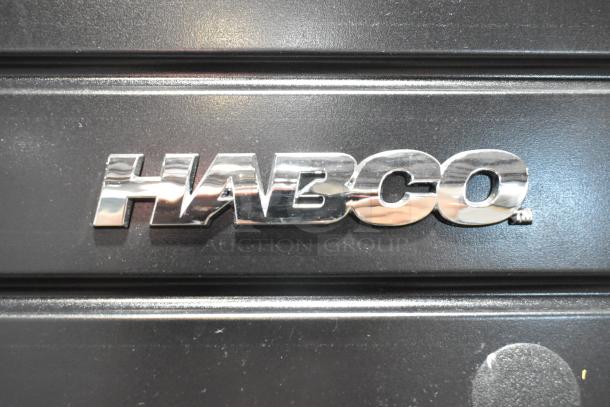 Habco SE18 cooler logo close-up. 2019 metal commercial single door model with poly coated racks, 115V, 1 phase.