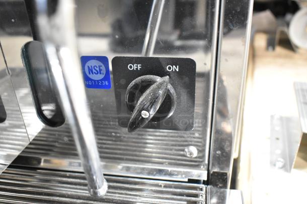 Brand new Estella ECEM3/N3 3-group espresso machine, stainless steel, 220-240V, NSF certified, on/off switch visible.