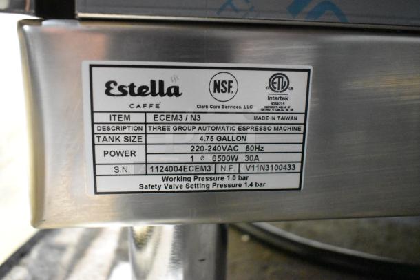 Alt text: Estella ECEM3/N3 stainless steel commercial espresso machine label, showing specs and serial number. 3 groups, 220-240V.