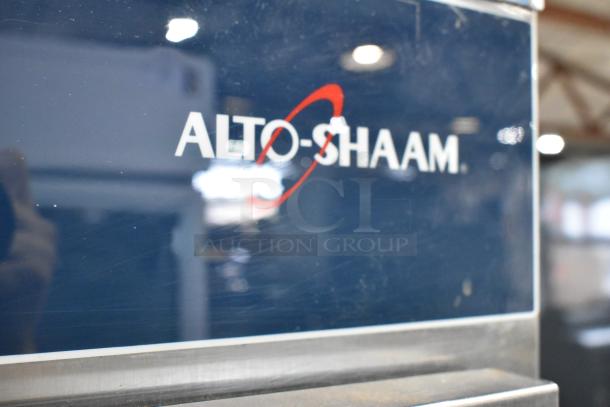 Alto Shaam 1200-UP stainless steel holding cabinet with Dutch doors and 16 pan capacity on commercial casters. 120V, 1 phase.