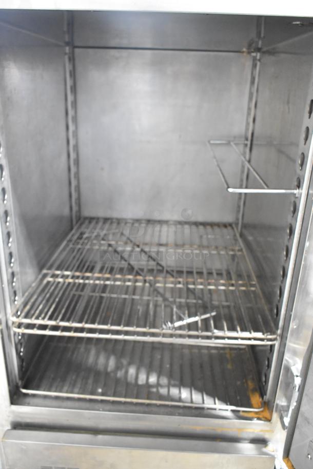 Alto Shaam 1200-UP stainless steel holding cabinet, 16-pan capacity, with Dutch door and commercial casters. 120 volts, 1 phase.