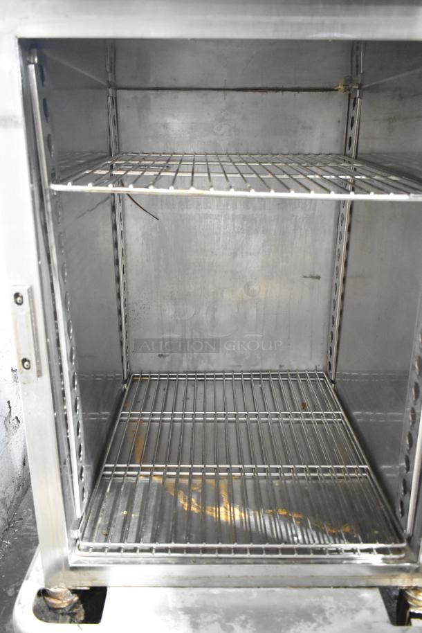 Alto Shaam 1200-UP stainless steel mobile holding cabinet for 16 pans, with Dutch door, on casters, used condition.