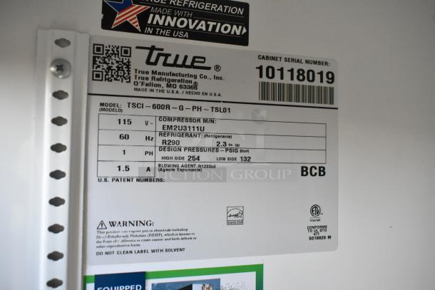 2021 True TSCI-600R-G-PH single door cooler, poly racks, 115V, 1 phase. Model and safety labels visible.