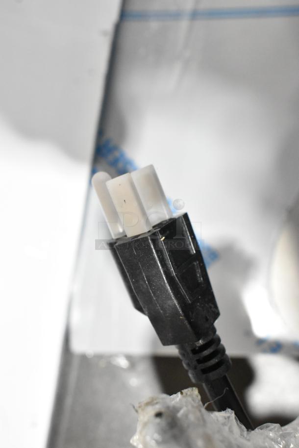 Close-up of a power plug for a 2025 Manitowoc IYT0750A-261 stainless steel ice machine.