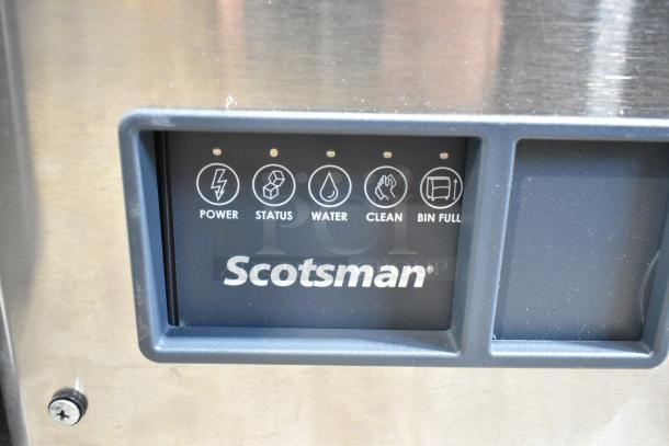 Scotsman MC0830MR-32A stainless steel ice machine control panel with power, status, water, clean, and bin full indicators.