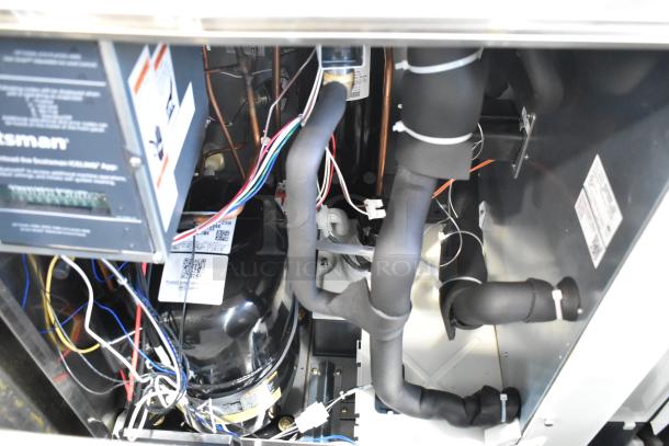 BRAND NEW Scotsman MC0830MR-32A ice machine interior, showing wiring and components. Medium cube, 870 lb. capacity, 208/230V.
