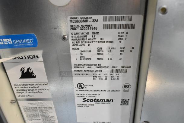 BRAND NEW 2025 Scotsman MC0830MR-32A Stainless Steel Ice Machine, 870 lb capacity, model and safety labels visible.