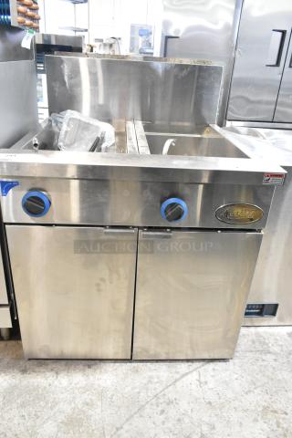 Brand new Avantco 177FPC22NL pasta cooker, stainless steel, 22-gallon, 140,000 BTU, minor dents, natural gas, two-section.