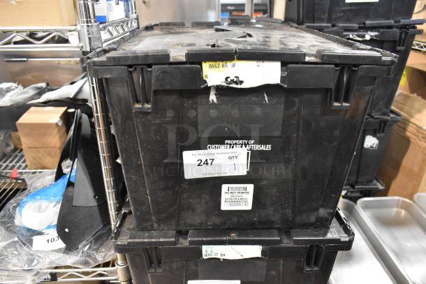 Black poly bin containing various items including GMC panels, labeled "Property of Customer Care Aftersales" with auction tag "247".