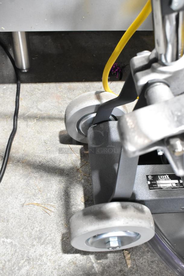 Brand new Lavex TP-2015 metal commercial floor cleaner, 120V, 1 phase. Scratch and dent model. Visible label with specifications.