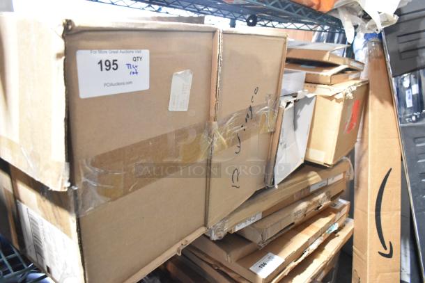Boxed tier lot with Corvette items, GM fender hash marks 84684590. Includes various items. Visible labels and markings.
