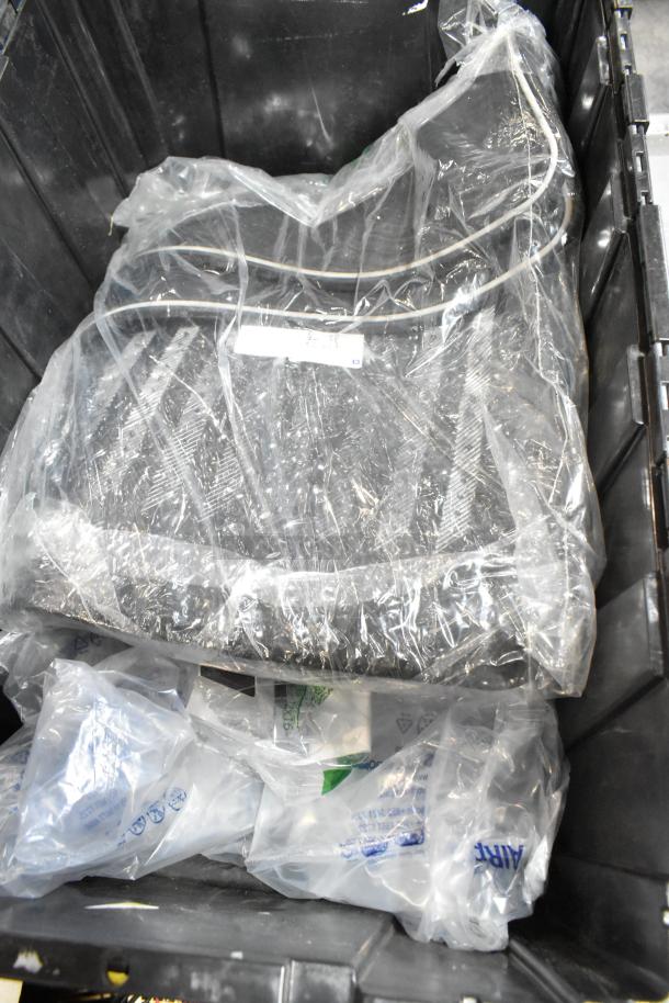 Lot of assorted items in black poly bin, including a mat; items are wrapped in plastic, condition appears used.