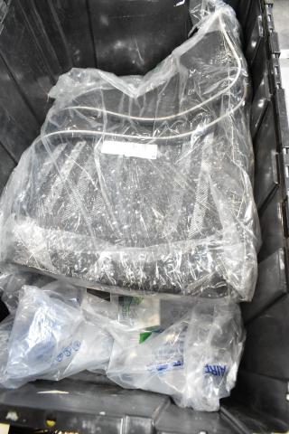 Lot of assorted items in black poly bin, including a mat; items are wrapped in plastic, condition appears used.