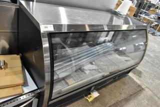 2025 Avantco 178DLC82HCB 82" black refrigerated deli case with curved glass, excellent condition, visible auction label.