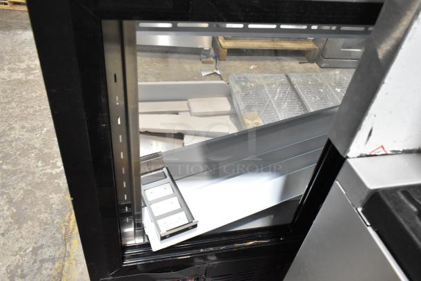 2025 Avantco 178DLC82HCB 82" black curved glass refrigerated deli case, showing interior shelving and black frame details.