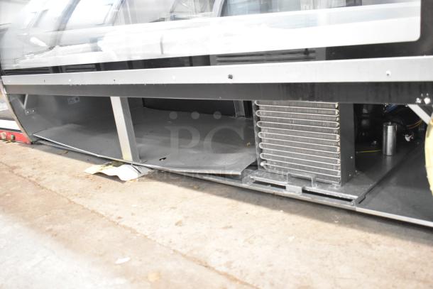 2025 Avantco 178DLC82HCB, 82" black curved glass refrigerated deli case; visible storage area; used condition.