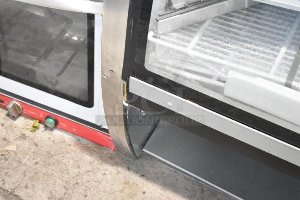 2025 Avantco 178DLC82HCB 82" black curved glass refrigerated deli case, minor visible wear, clear glass and metal trim.