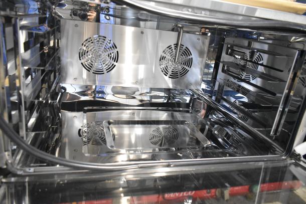 Brand new Avantco 177CO46M convection oven interior, featuring dual fans and stainless steel finish. Scratch and dent model.