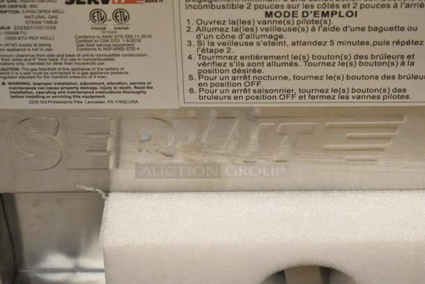 "ServIt 423GST3WENG steam table label showing brand name and safety instructions, highlighting model features."