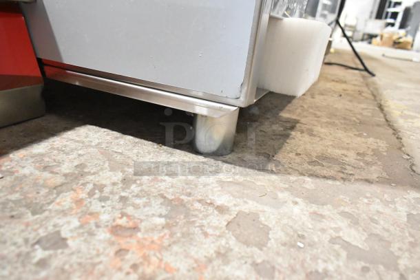 Stainless steel base of ServIt 423GST3WENG steam table, showing new condition with protective foam, minor scratches visible.
